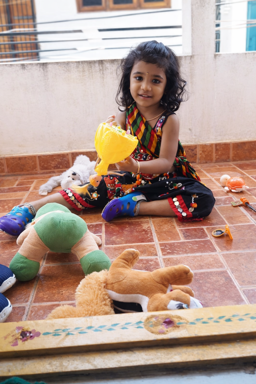 Keerthi playing with toys