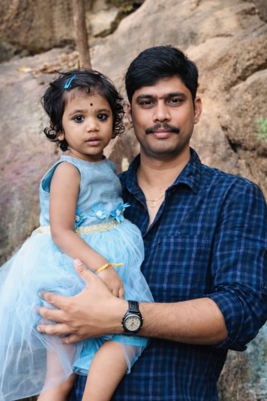Keerthi with Papa at temple